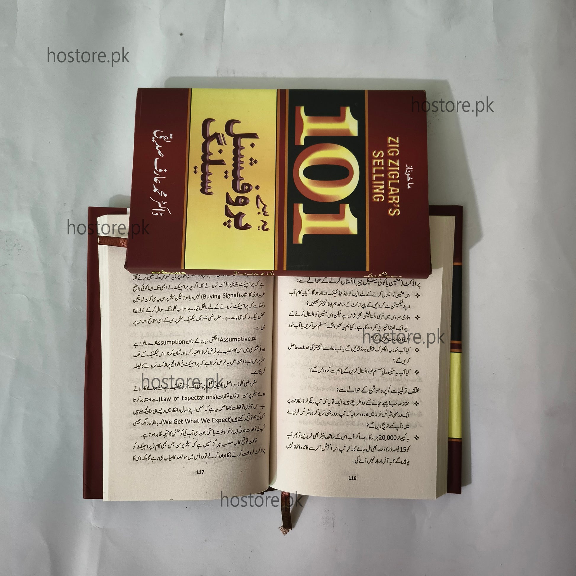 Open book with '101 Selling' cover on a white background