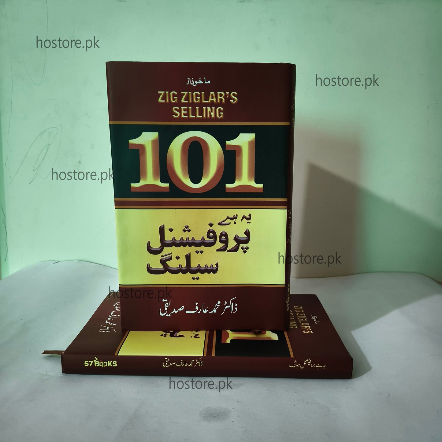 Book titled '101 Proven Selling Strategies' by Zig Ziglar on a white surface with a light green background.