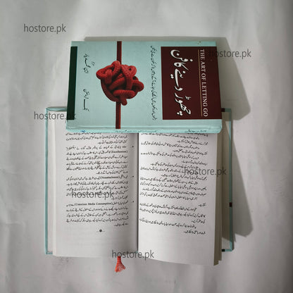 Open book with a red knot design on the cover, displayed against a light gray background.